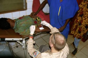 Remote Medical's resident herpetologist and envenomations expert, Jordan, treating a snakebite patient in Benin.