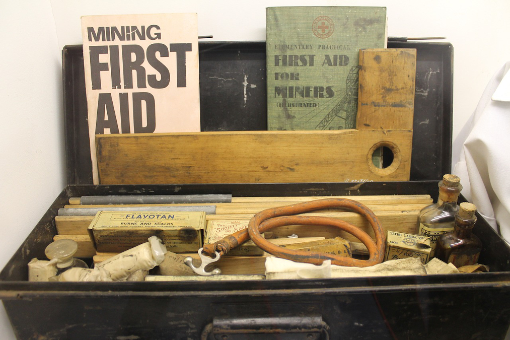 A picture of an old school mining first aid kit.