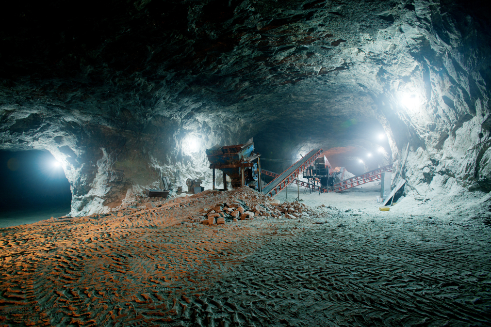 A photo of mining work being performed underground.